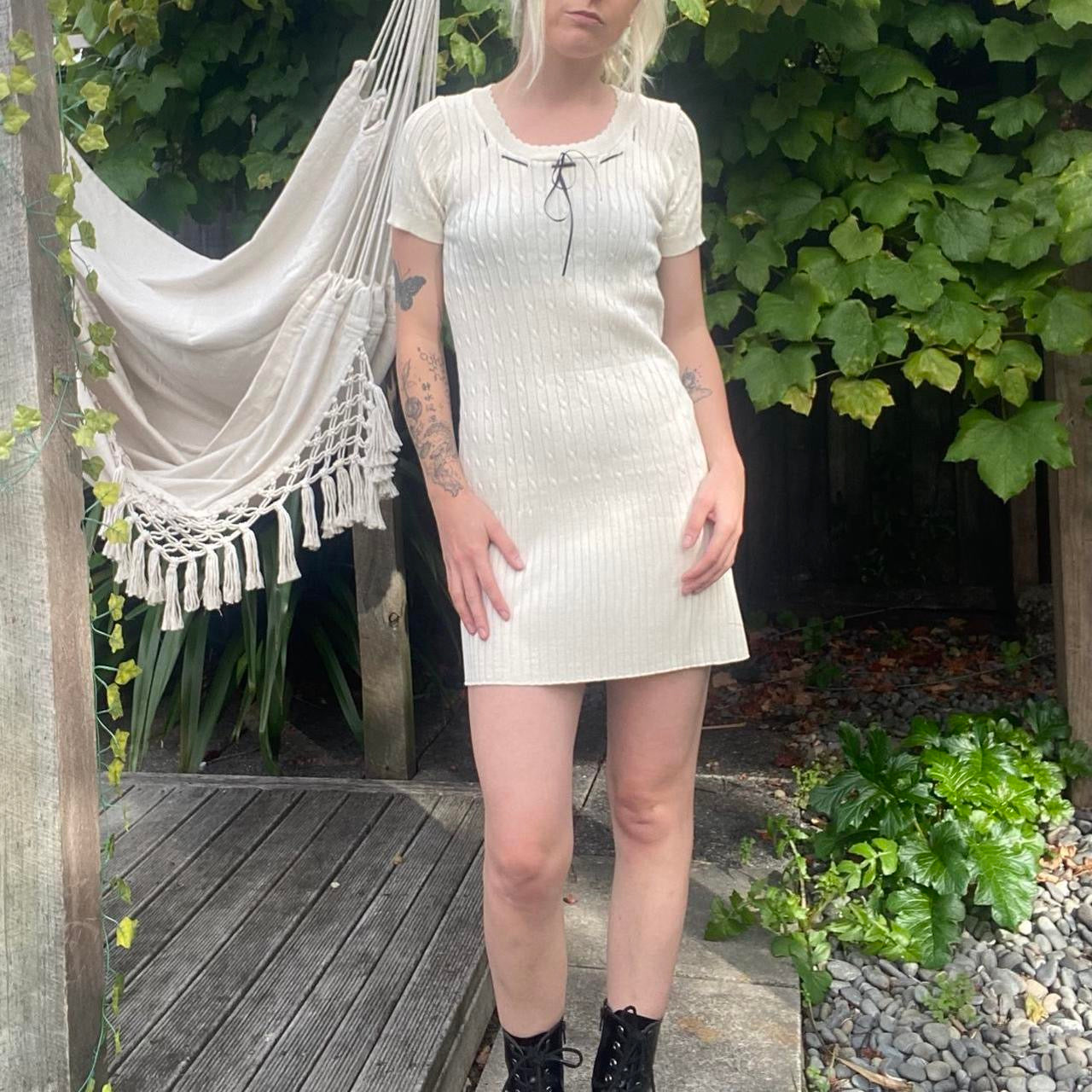 The cutest cream knit dress with black bow
