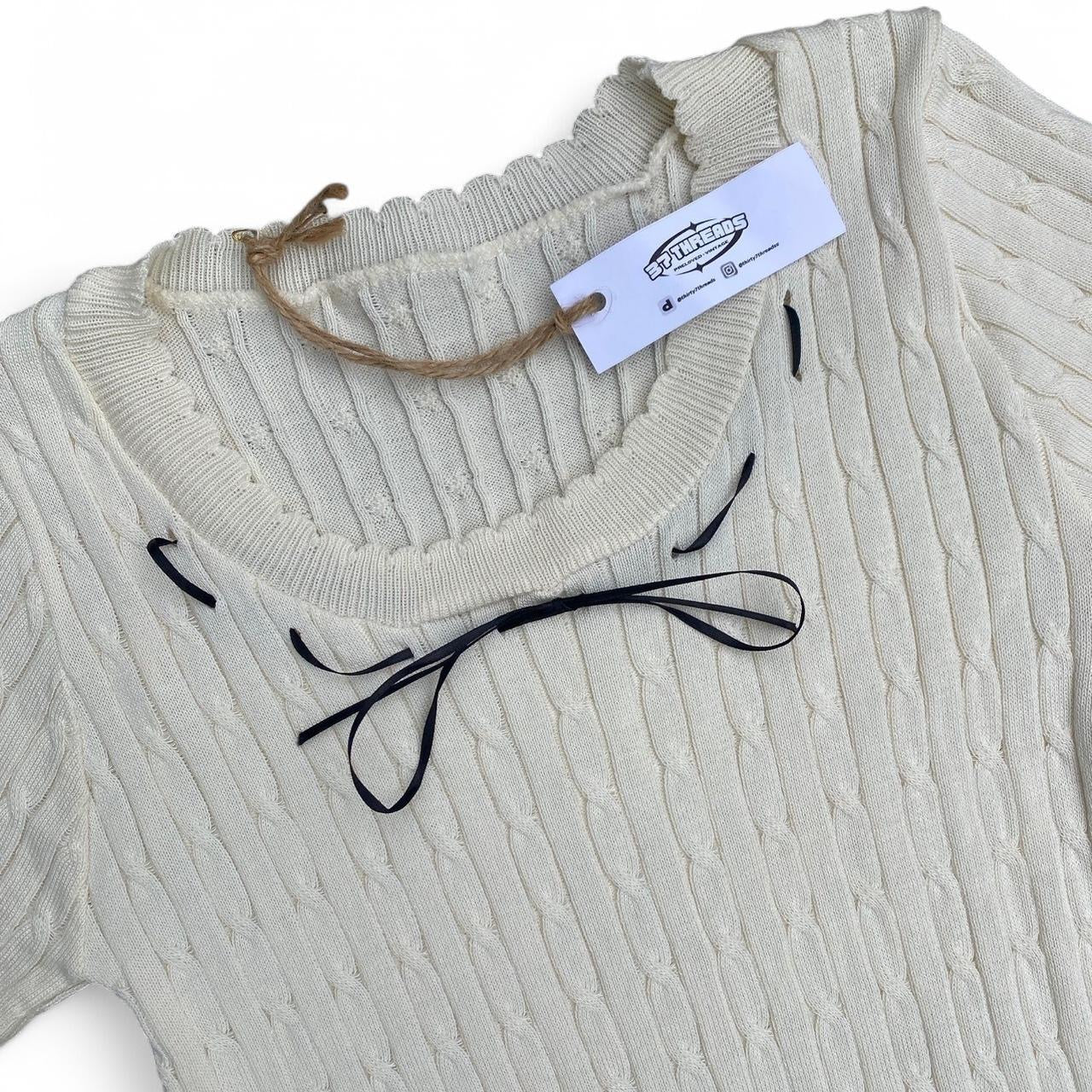 The cutest cream knit dress with black bow