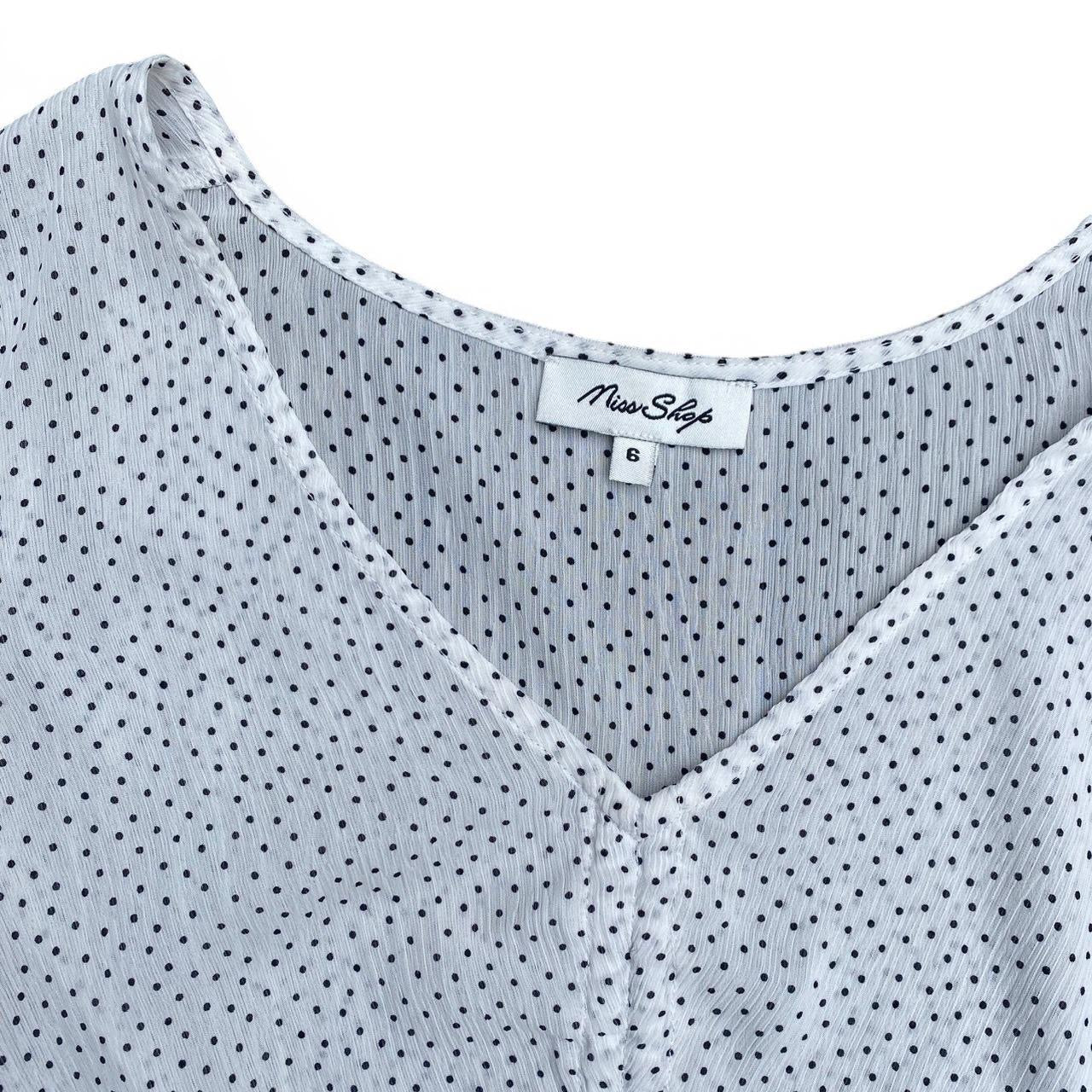White polka dot peplum top with ruffles!
