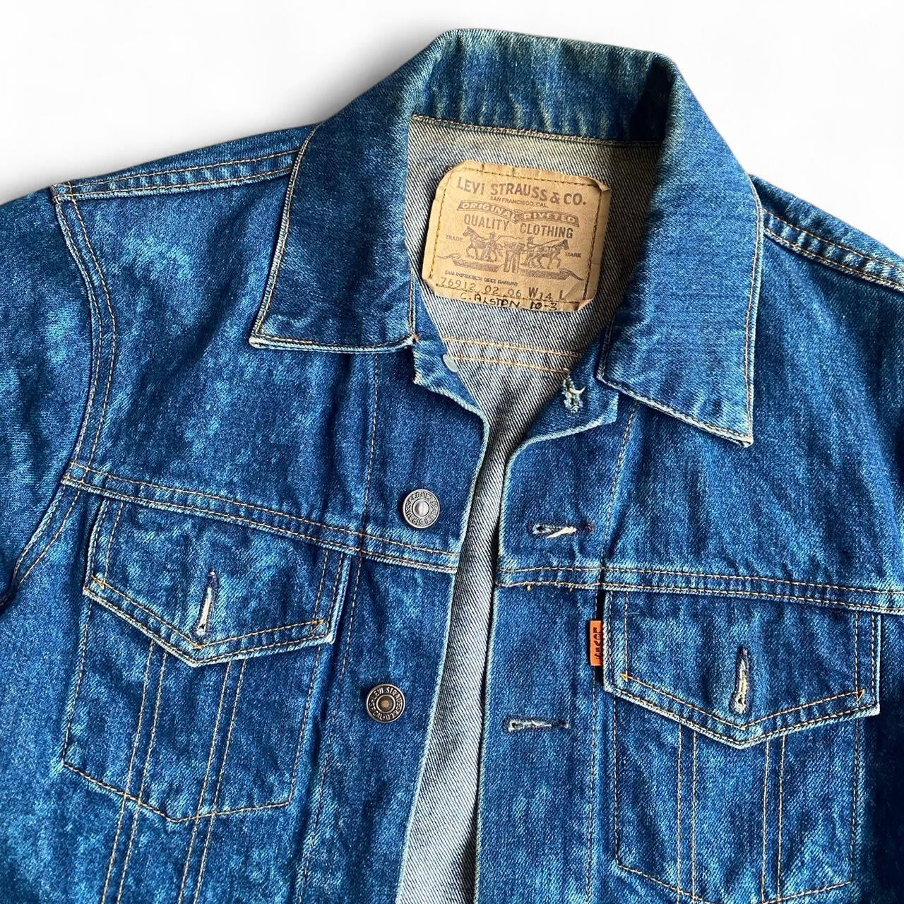 Vintage Levi's fitted blue denim jacket with acid wash finish