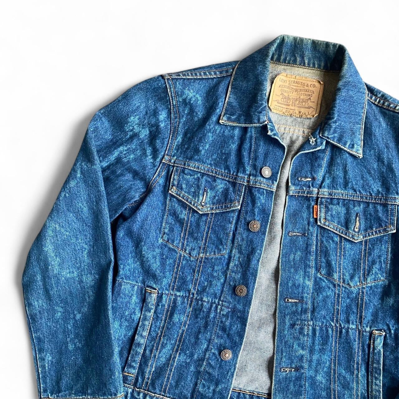 Vintage Levi's fitted blue denim jacket with acid wash finish