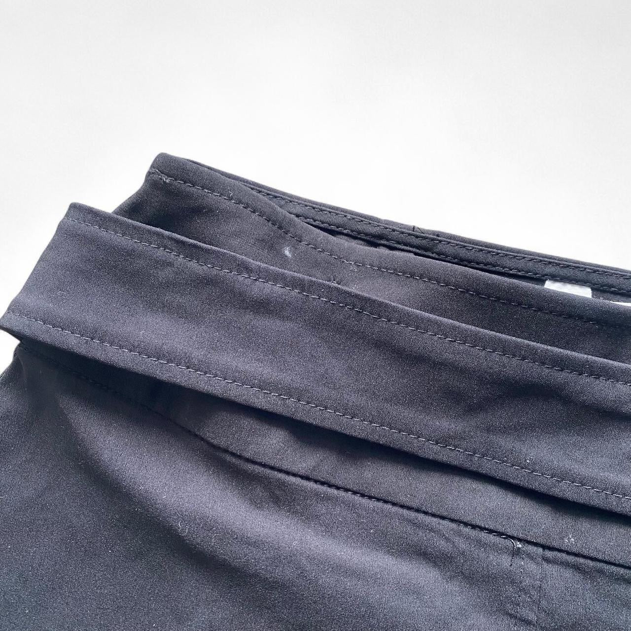 Black pleated mini skirt with built in belt