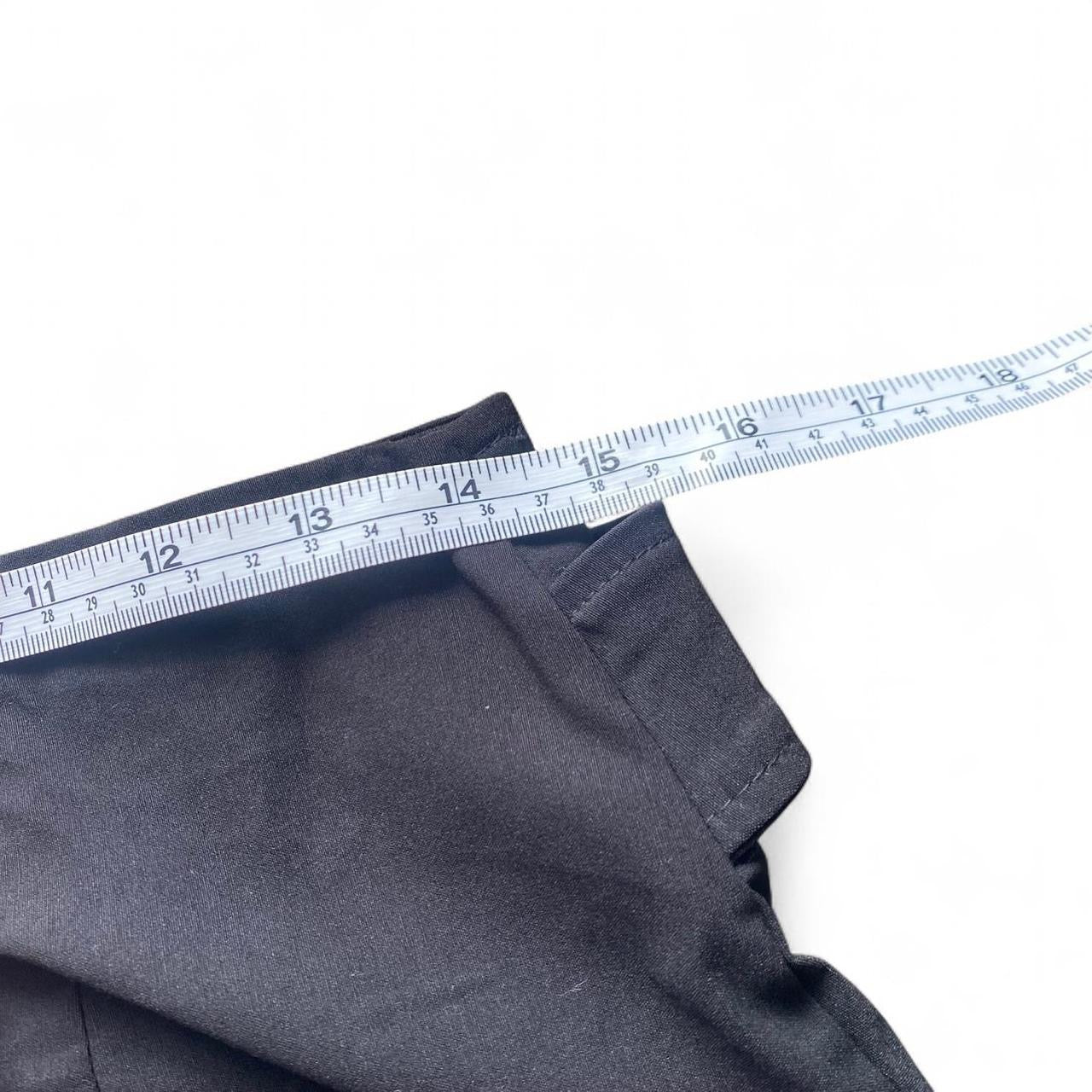 Black pleated mini skirt with built in belt