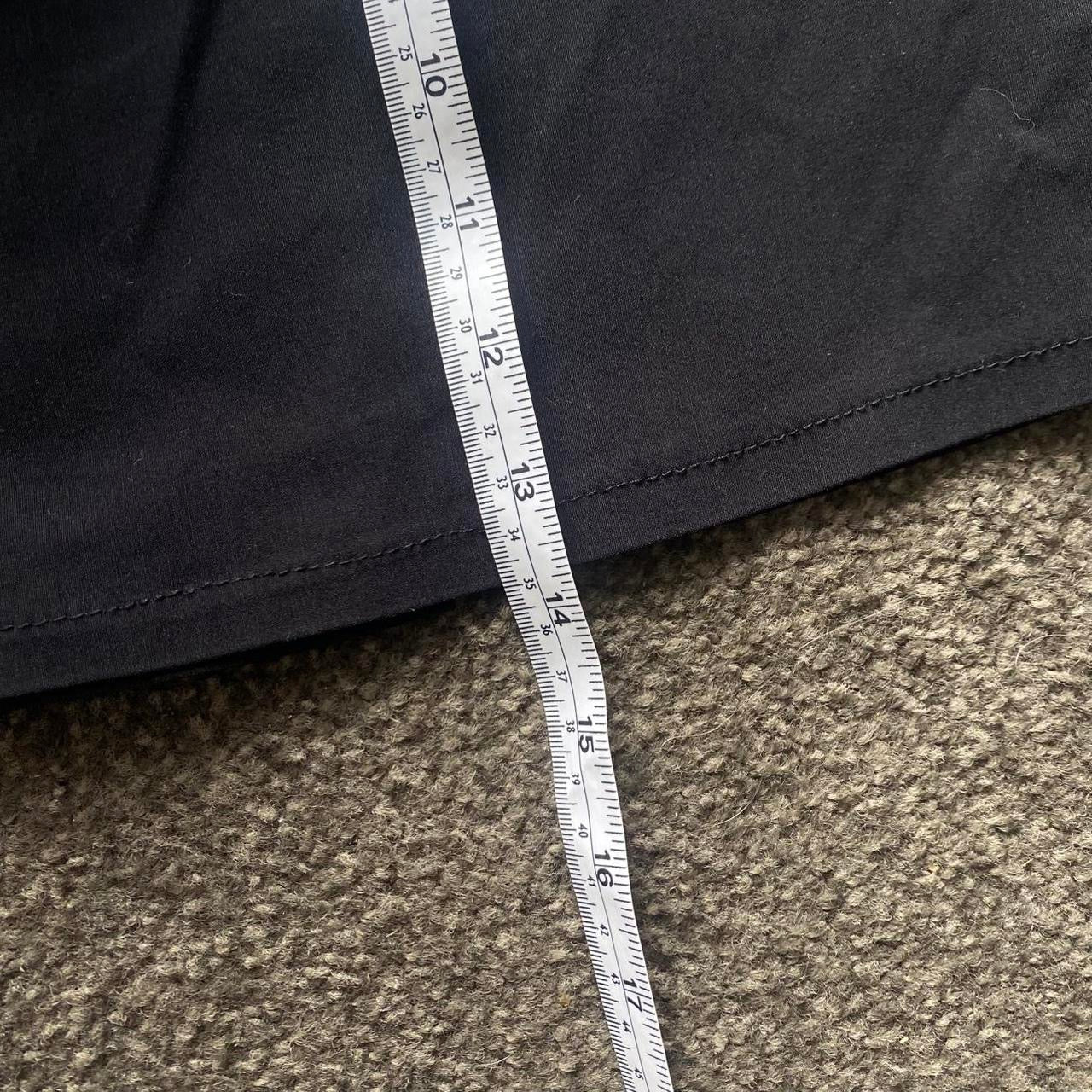 Black pleated mini skirt with built in belt