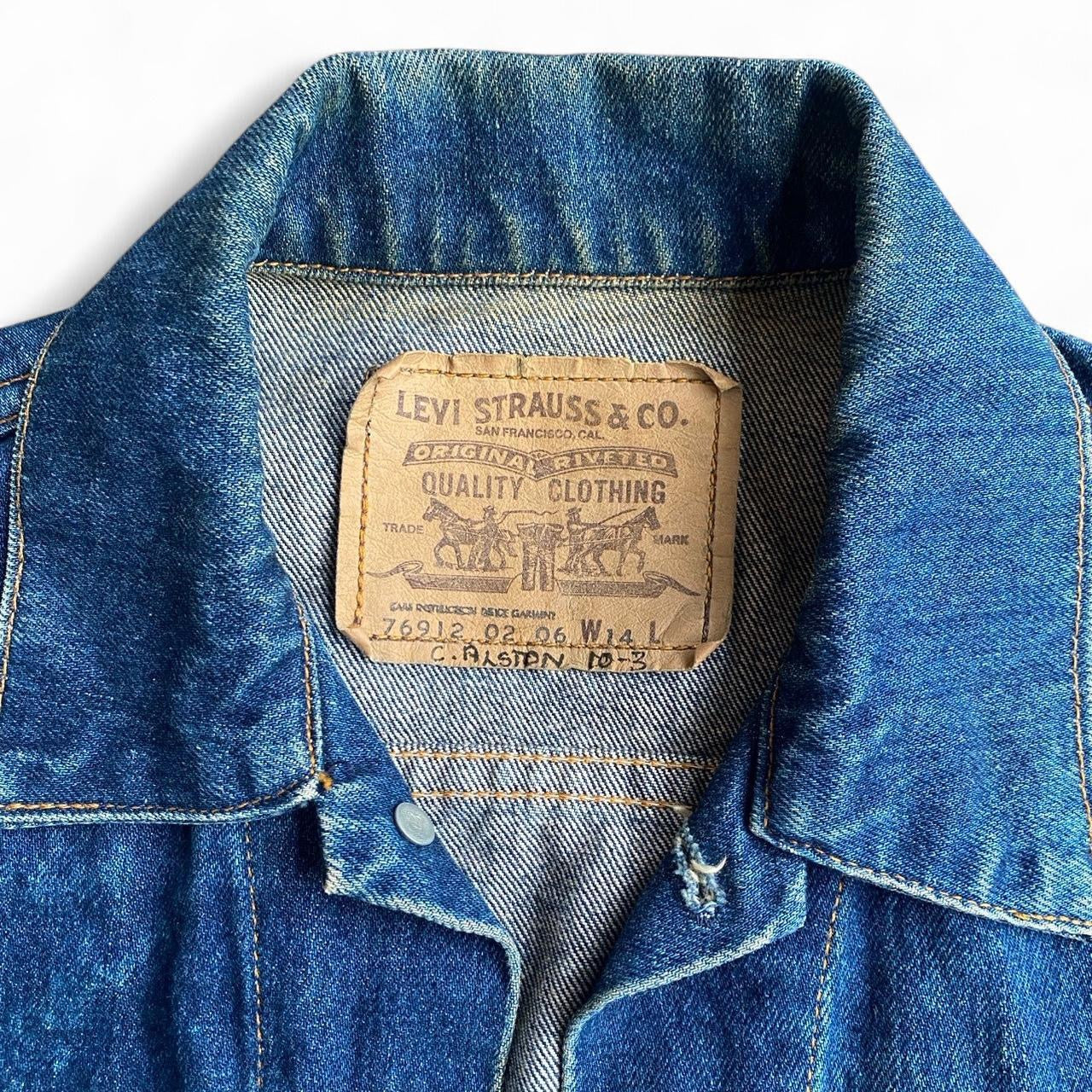Vintage Levi's fitted blue denim jacket with acid wash finish