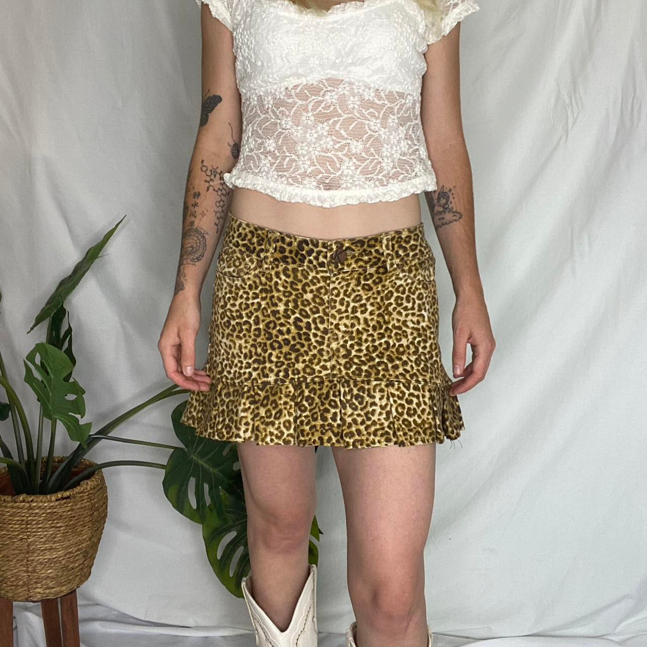 Re-worked cheetah print pleated mini skirt