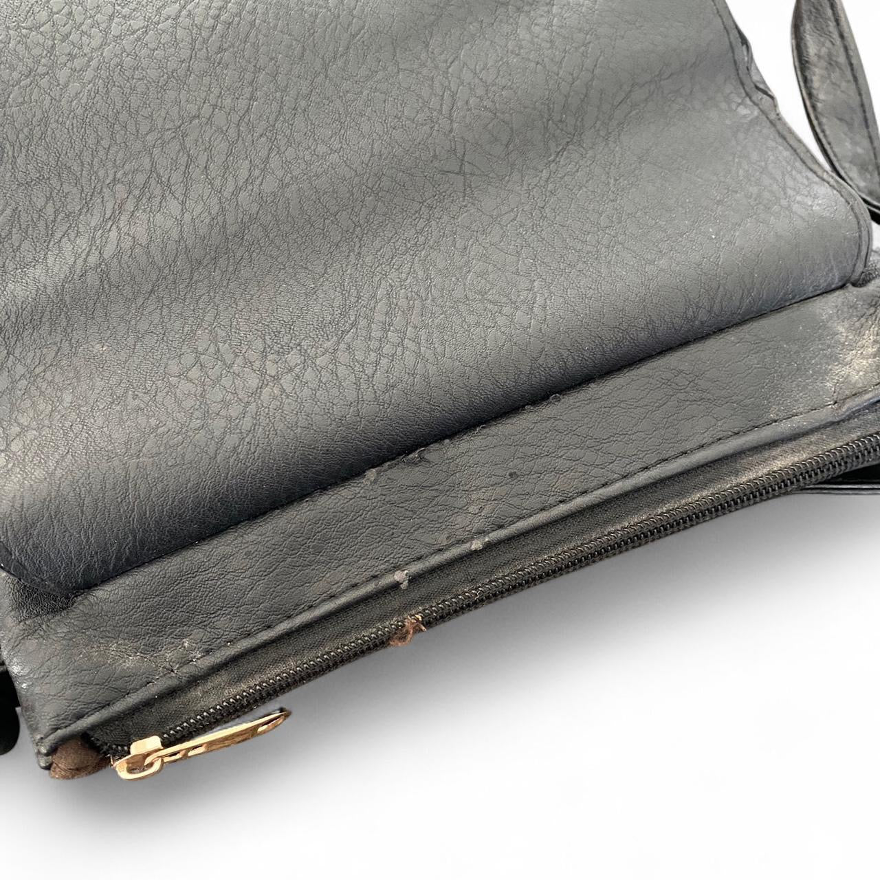Black leather crossbody bag with cute floral design