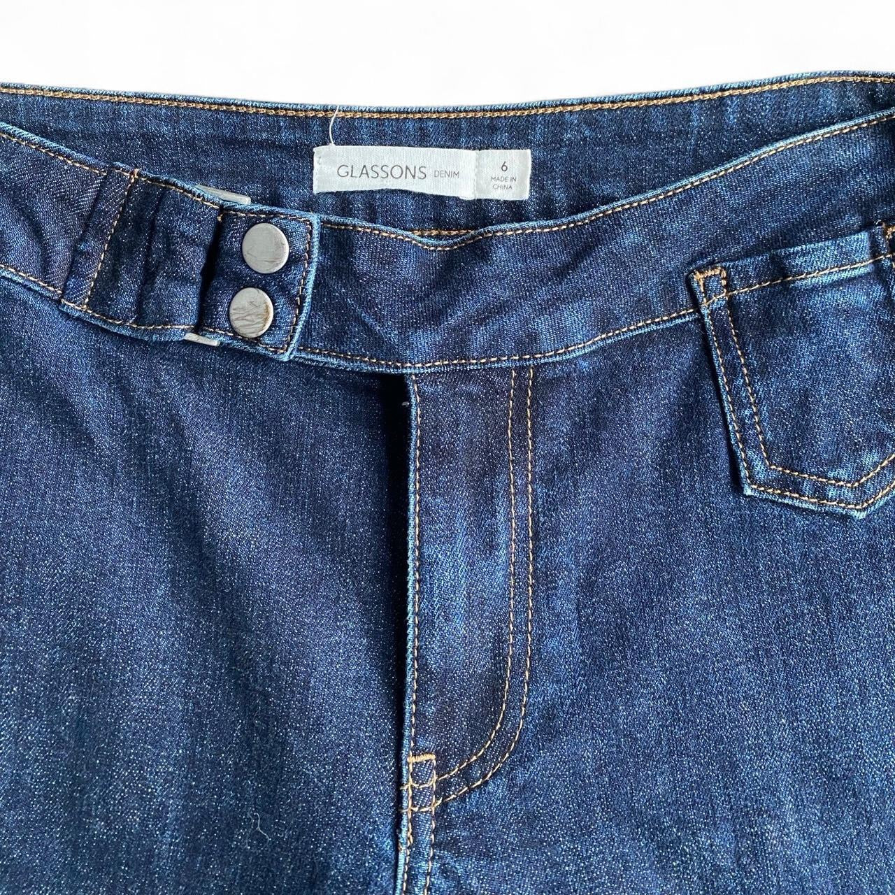 Low-rise flare jeans with button belt detail